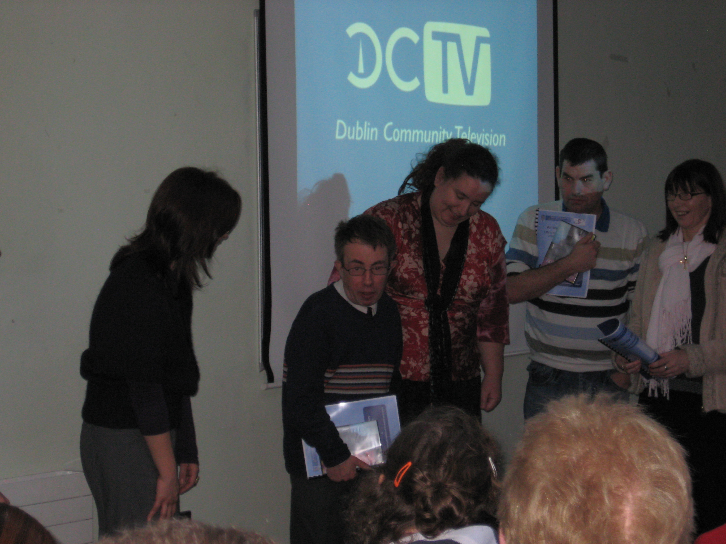 Members of the All We Want to Say project making a presentation about the DVD at the NIID, Trinity College. 